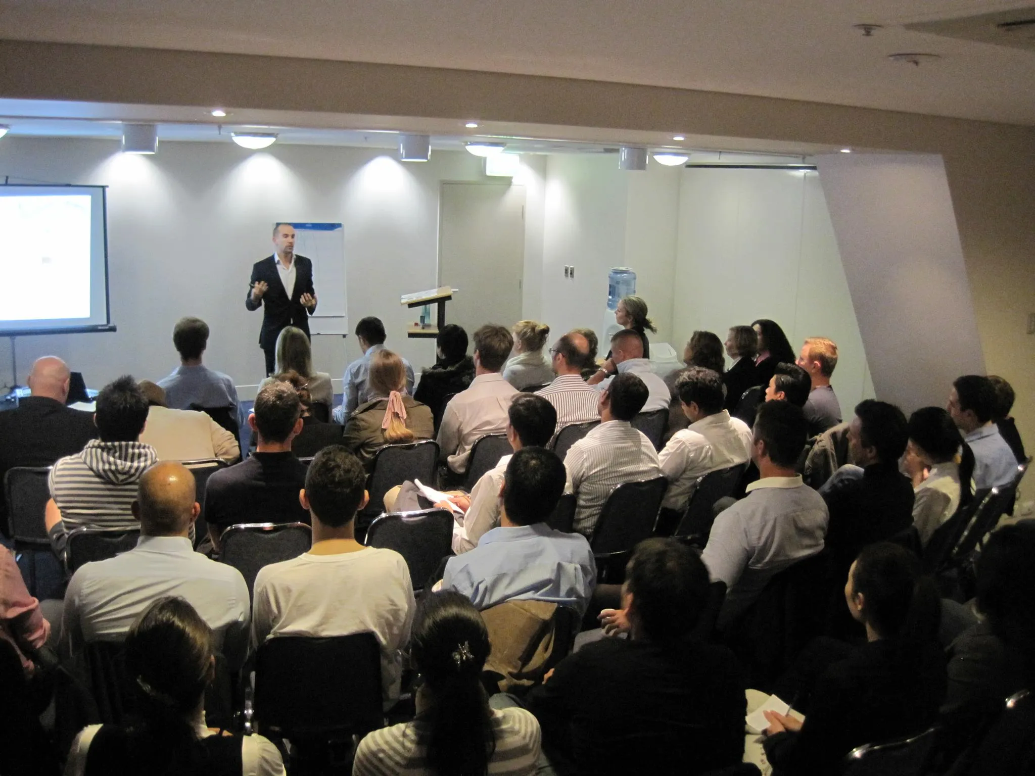 Cyril presenting (pink background)