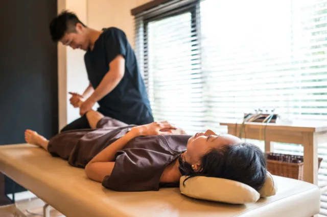 Modern chiropractic website displayed on mobile and desktop with clear booking pathway