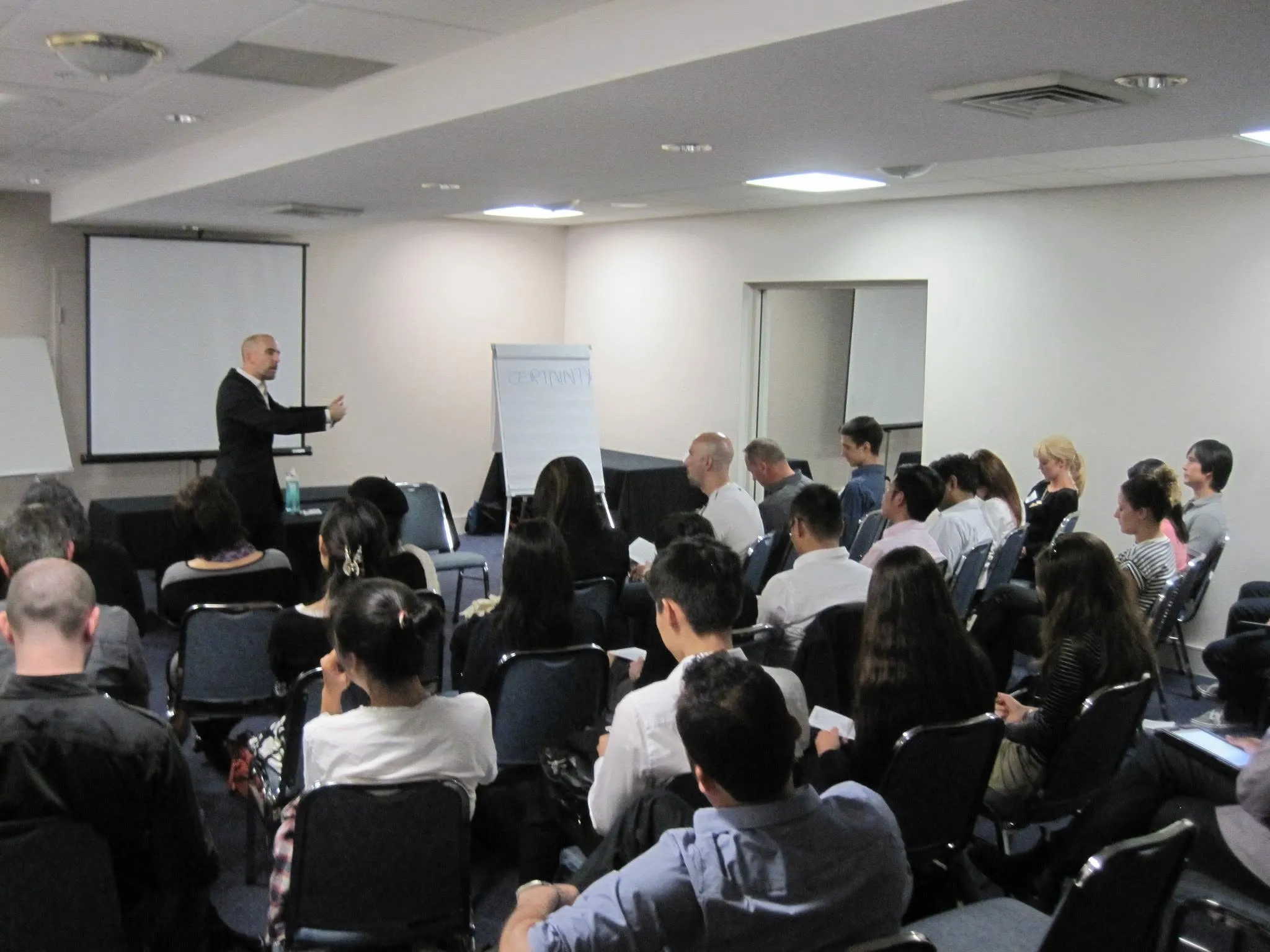 Cyril Sansano presenting on stage